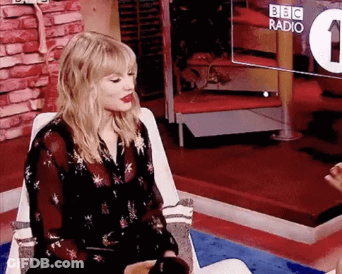 Woman Sitting At BBC Radio Screen GIF