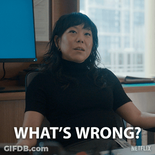 Woman Sitting At Computer Saying What's Wrong GIF