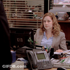 Woman Sitting At Desk In Front Of HP Monitor GIF