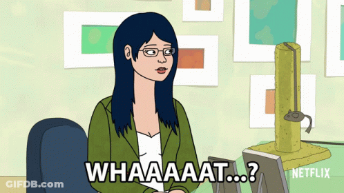 Woman Sitting At Desk Saying What GIF