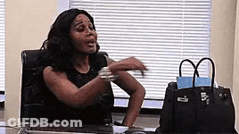 Woman Sitting At Desk With Arms Outstretched GIF