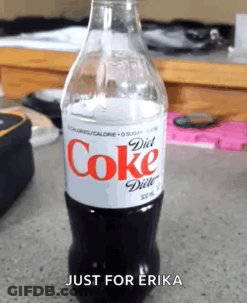 Woman Sitting At Desk With Coke GIF