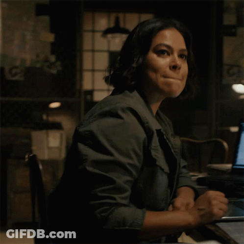 Woman Sitting At Desk With Laptop Saying Copy GIF