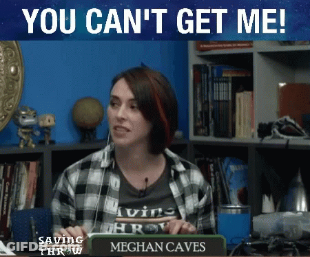 Woman Sitting At Desk With Meghan Caves Sign GIF