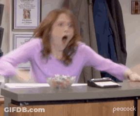 Woman Sitting At Desk With Mouth Open GIF