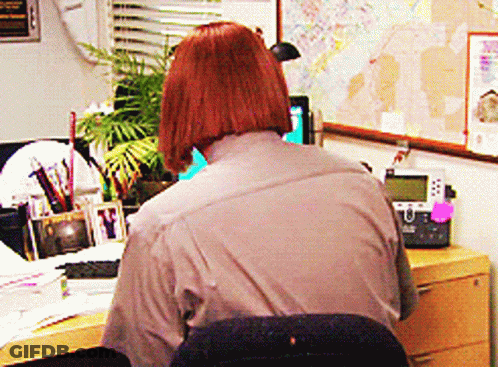 Woman Sitting At Desk With Telephone And Map GIF