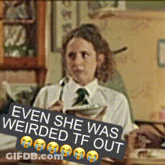 Woman Sitting At Desk With Weirded Out Sign GIF