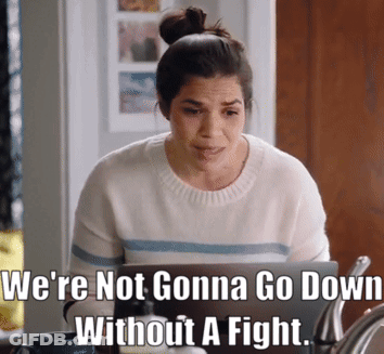 Woman Sitting At Laptop With We're Not Gonna Go Down Without A Fight Meme GIF