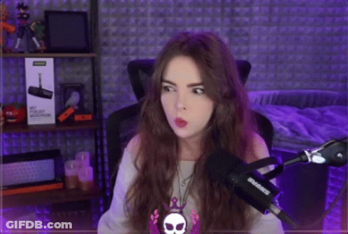 Woman Sitting At Microphone In Purple Lights GIF
