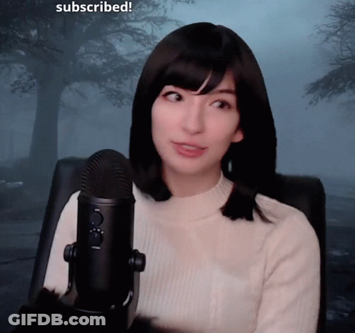 Woman Sitting At Microphone Saying Subscribed GIF