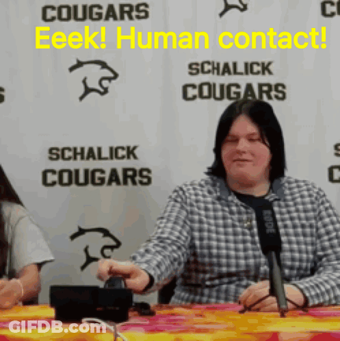 Woman Sitting At Microphone Sign Schalick Cougars GIF