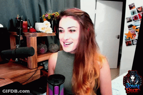 Woman Sitting At Microphone With Jowy Bear GIF