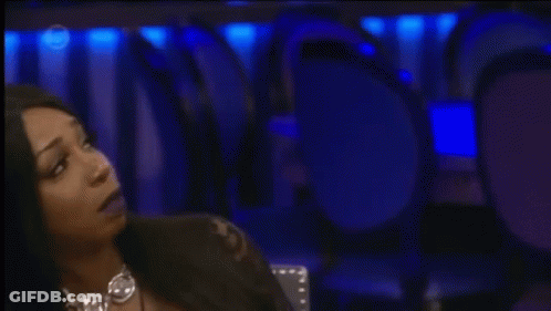 Woman Sitting At Microphone With Number 5 On Screen GIF