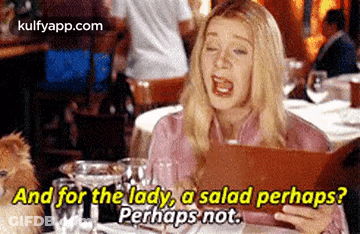 Woman Sitting At Restaurant Looking At Menu Talking About Salad GIF