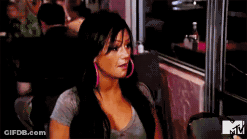 Woman Sitting At Restaurant Table With Open Mouth GIF