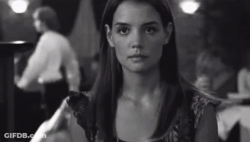 Woman Sitting At Restaurant Table GIF
