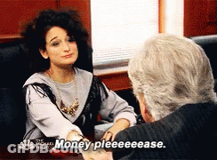 Woman Sitting At Table Asking For Money GIF
