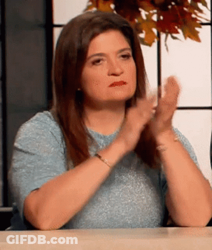 Woman Sitting At Table Clapping GIF