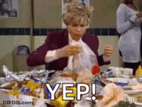 Woman Sitting At Table Eating Food GIF