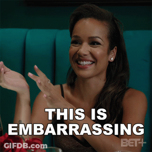 Woman Sitting At Table Embarrassed GIF