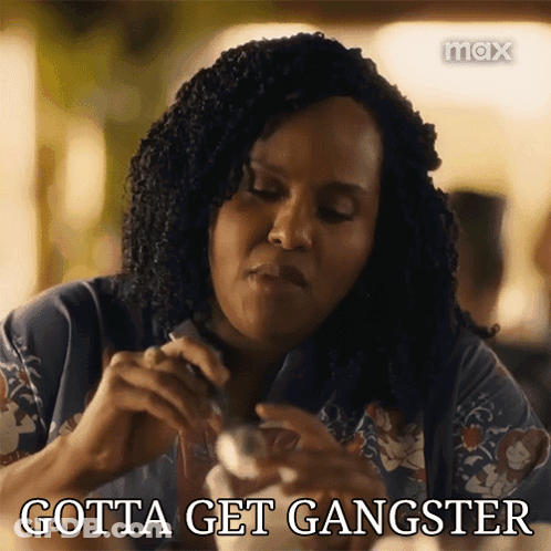 Woman Sitting At Table Gotta Get Gangster GIF