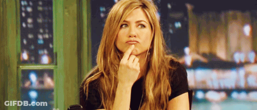 Woman Sitting At Table Hand On Chin GIF