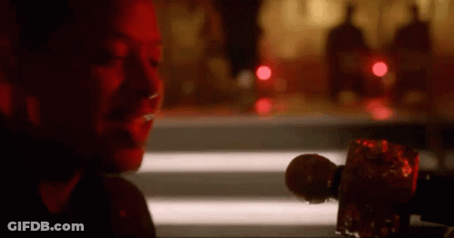 Woman Sitting At Table Holding Microphone GIF