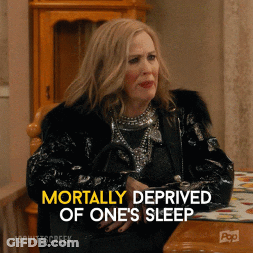Woman Sitting At Table Mortally Deprived Of One's Sleep GIF