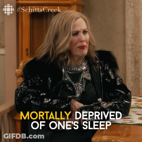 Woman Sitting At Table Mortally Deprived Of One's Sleep GIF