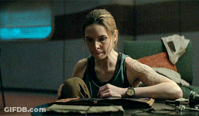 Woman Sitting At Table Reading Book GIF
