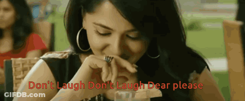 Woman Sitting At Table Saying Don't Laugh Don't Laugh GIF