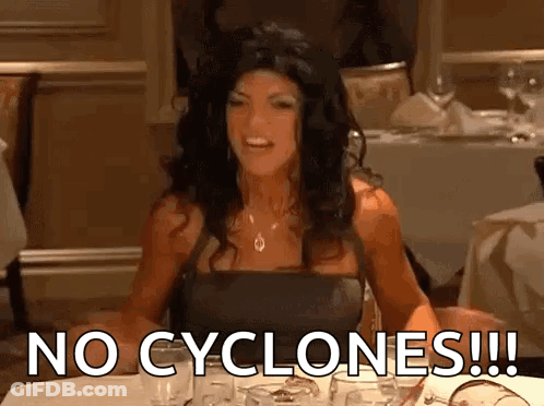 Woman Sitting At Table Saying No Cyclones GIF