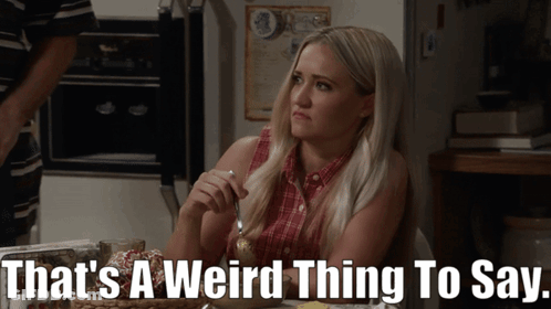 Woman Sitting At Table Saying That's A Weird Thing To Say GIF