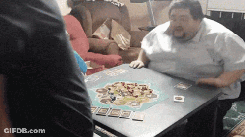 Woman Sitting At Table Saying Wait What GIF