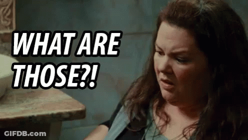 Woman Sitting At Table Saying What Are Those GIF