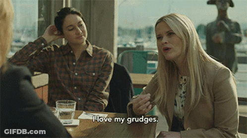 Woman Sitting At Table Says I Love My Grudge GIF