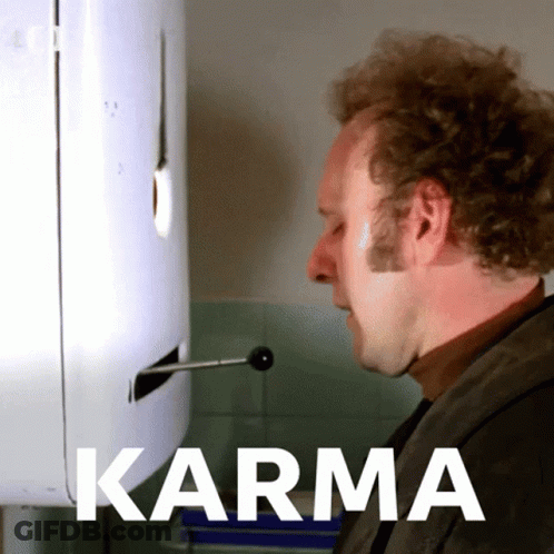 Woman Sitting At Table With Beer Saying Karma Will Find You GIF