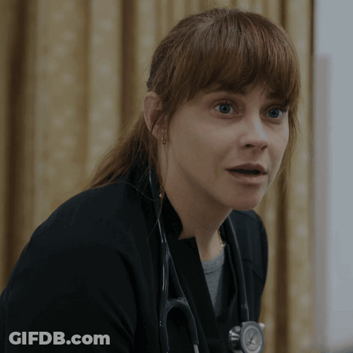 Woman Sitting At Table With Beer GIF