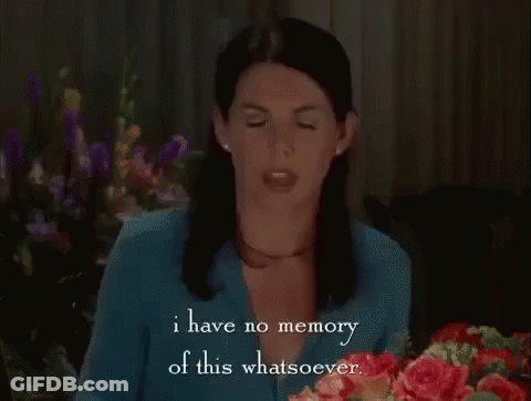 Woman Sitting At Table With Bouquet Talking GIF