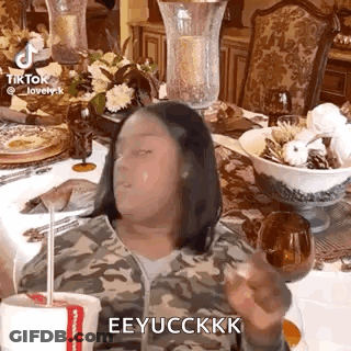 Woman Sitting At Table With Coffee GIF