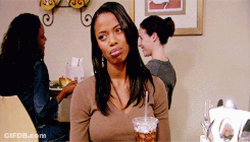 Woman Sitting At Table With Cup Of Soda GIF