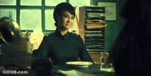Woman Sitting At Table With Food GIF