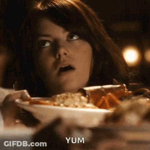 Woman Sitting At Table With Food GIF