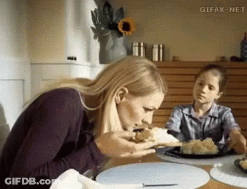 Woman Sitting At Table With Food GIF