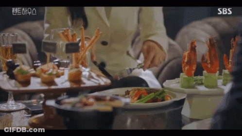 Woman Sitting At Table With Food GIF