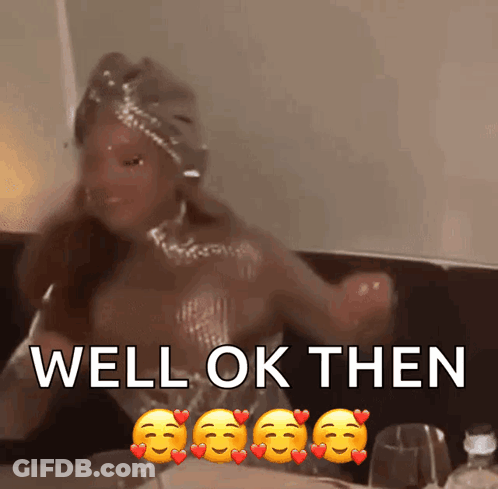 Woman Sitting At Table With Hearts Saying Well Ok Then GIF