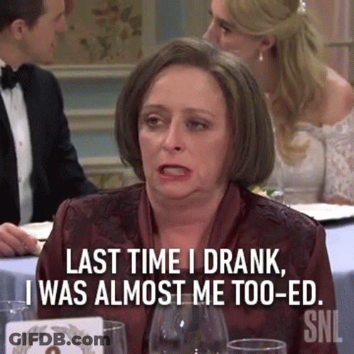 Woman Sitting At Table With Last Time I Drank Sign GIF