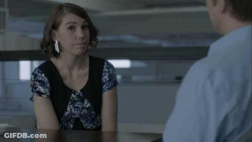 Woman Sitting At Table With Man In Blue Shirt GIF