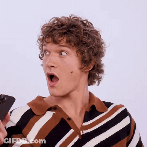 Woman Sitting At Table With Mouth Open GIF