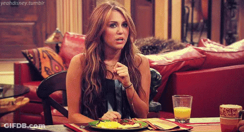 Woman Sitting At Table With Plate Of Food And Orange Juice GIF